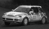 Mazda 323 GTX, No.11, 1000 Lakes Rallye, with night lights, H.Mikkola/A.Hertz, 1990